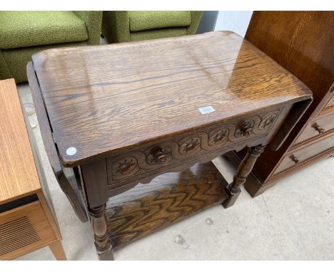 A DROP LEAF OAK SIDE TABLE WITH SINGLE DRAWER AND LOWER SHELF 