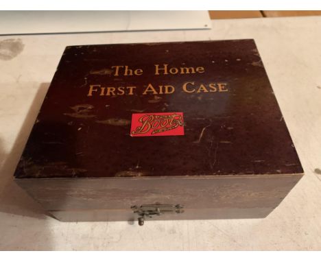 A 1920'S/30'S  BOOTS THE CHEMIST 'THE HOME FIRST AID KIT', IN A WOODEN CASE 