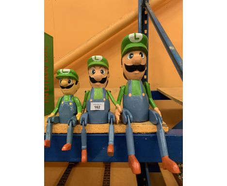 A GRADUATED SET OF THREE VINTAGE STYLE LUIGI SUPER MARIO SHELF PUPPETS 