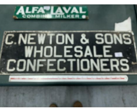 A VINTAGE 'C NEWTON &amp; sONS WHOLESALE CONFECTIONERS' SIGN FROM A STREET IN NORTHWICH 