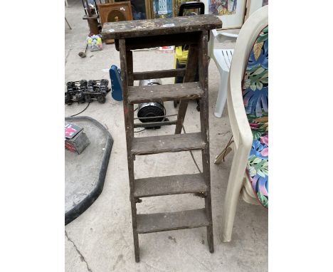 A SET OF VINTAGE WOODEN STEP LADDERS 