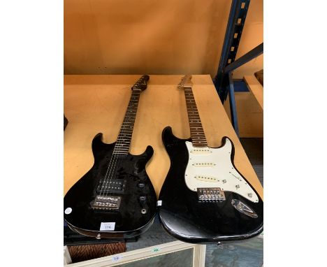 TWO ELECTRIC GUITARS, ONE ENCORE, SOME STRINGS MISSING AND ONE STAGG, NO STRINGS 