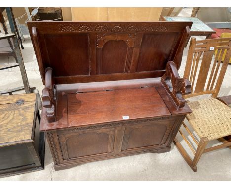 AN OAK MONK'S BENCH SEAT - CONVERTS TO A TABLE 