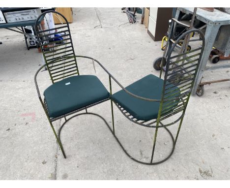 A VINTAGE METAL LOVE SEAT 