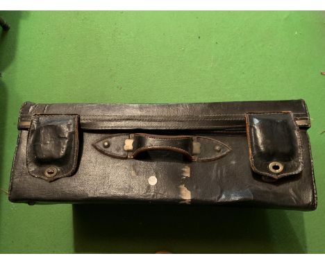 A VINTAGE LARGE LEATHER CASE 