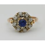 1 Damenring gest. 583 (GG 14ct. Säure hält), zentral 1 blauer Stein ca. D 4,5mm und weiße Steine, Ri