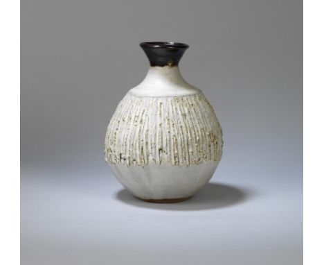 JANET LEACH (AMERICAN, 1918-1997)Vase, circa 1973Stoneware, grey glaze over a heavily textured body, with a dark iron glaze. 