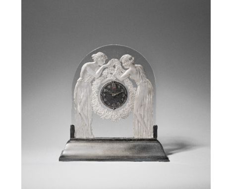 RENÉ LALIQUE (FRENCH, 1860-1945)'Deux Figurines' mantel clock, designed 1926Clear glass, moulded and frosted, on illuminated 