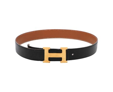 HERMÈS VINTAGE Gürtel, Länge max. 85cm. Koll. 1991. Klassischer Wenderiemen in Schwarz und Hellbraun mit goldfarbener H-Schli