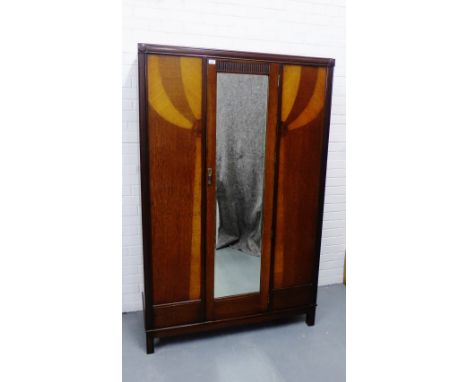 An Art Deco oak wardrobe, with light oak balloon motifs and central mirrored door,  190 x 120cm 