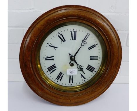 An oak framed wall clock, the enamel dial with Roman numerals, 38cm diameter