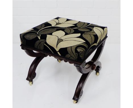 A mahogany x frame stool, with upholstered top and ceramic castors,  38 x 42cm 