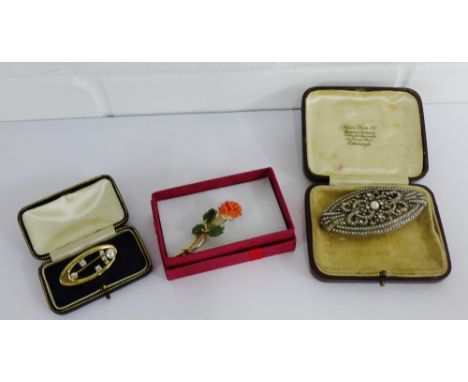 A coral and jade 'rose' brooch together with an Art Deco marcasite brooch and a gold plated and paste set brooch (3) 