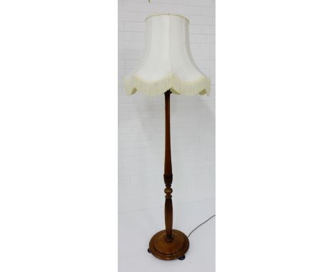 A mahogany standard lamp and shade, 180cm high