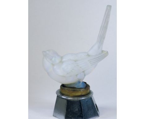 A Sabino Mocking Bird Mascot. Mounted on a brass and chromium-plated illumination base, (light fitting missing) the genus of 