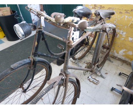 Two Bicycles.  A BSA loop frame bicycle with original green enamel finish, completer with mudguards, chainguard, and rear rac