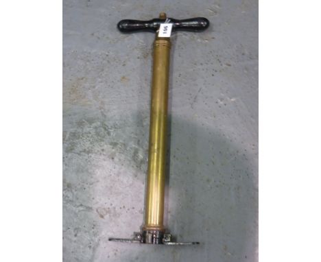A Vintage Brass Tyre Pump, a Michelin Man for fitting to an electric pump, and three coach lamps. (5)
