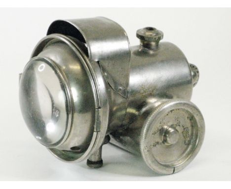 A French-Manufactured Acetylene Gas Lamp. A c1910 transverse carbide of calcium container style lamp, nickel-plated on brass 