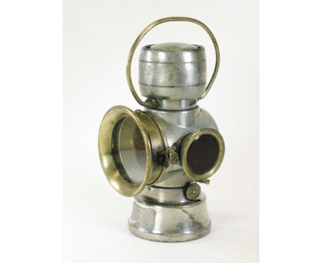 A Joseph Lucas, 630 Series Lamp. A combination number plate and rear oil-powered lamp with correct oil reservoir, carrying ba