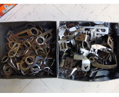 Lamp Brackets.  Two boxes holding both headstock brackets and front and rear mounting brackets. Various types and conditions.