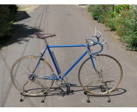 A Gitan Lightweight Bicycle, having a 22-inch frame finished in electric blue enamel with polished chromium-plated lugs, side