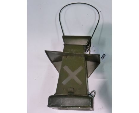 A WWII Crossroads Lantern.  An original but unused oil-powered lamp, finished in green, with carrying bail and original box. 