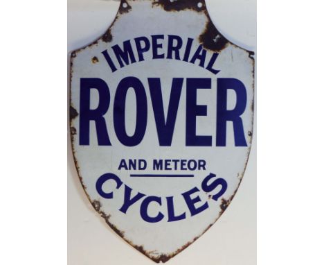 A Rover Advertising Enamel Sign.  A shield-shaped two-colour enamel wall sign, in very good condition save for a little chipp
