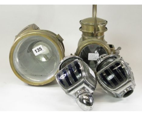 Four Lamps.  A small brass acetylene-gas-powered motorcycle lamp, a pair of chromium-plated benzene 'Opera Lamps', and a smal