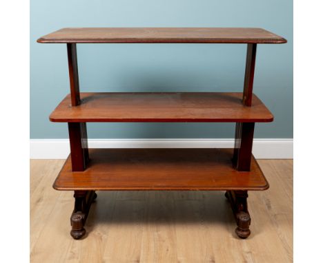 A Victorian mahogany adjustable three tier buffet The top and bottom raising and lowering to become a side table with fluted 