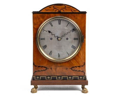 A Regency repeater table clock by Grimaldi & Johnson The Neoclassical mahogany case with an arching top, and ebony and brass 