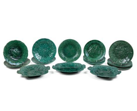 A collection of late 19th century leaf moulded green Majolica plates and dishes To include five Wedgewood plates and nine oth