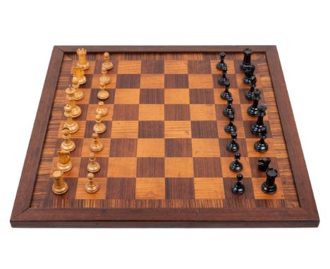A Staunton chessboard and chess pieces The board of kingwood and satinwood inlay. The pieces of ebony and fruitwood.The board
