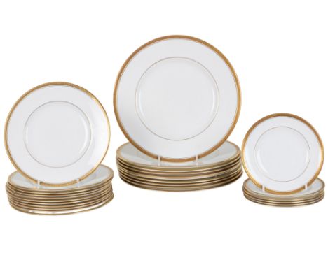 A Coalport porcelain part dinner service The service with gilt borders and line decoration on a white ground, 'The Elite' pat
