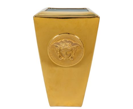 A Rosenthal for Versace gold vanity vase Of tapering square form and a moulded Medusa mask to the front and back.19cm wide x 