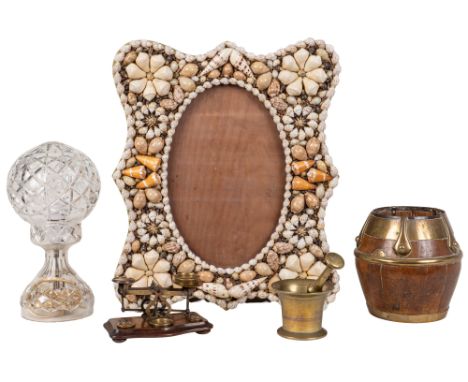 A group of decorative ornaments An Arts &amp; Crafts brass-bound jardinière; a shell-decorated picture frame; a glass table l