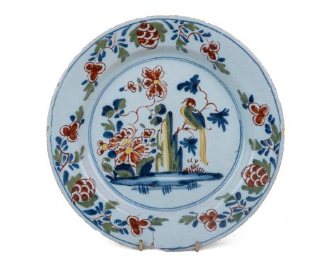 An 18th century English Delftware polychrome plate With foliate and bird hand-painted decoration to the centre.22.5cm diamete