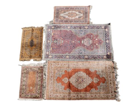 A collection of five Persian rugs and prayer mats The largest of the group is a Kashan prayer mat with Tree of Life motif.The