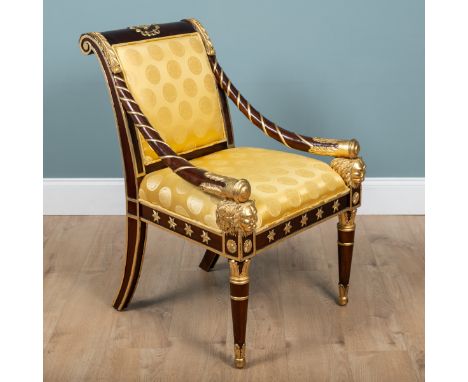 A Versace Empire-style mahogany-framed library chair With carved gilt decorations, the outscrolling top rail with downswept a