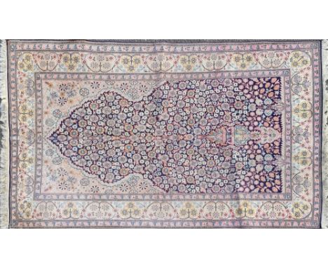 A 20th century silk Agra-style prayer mat With an all-over floral decoration to the mihrab and guarded border.200cm x 127cmQt