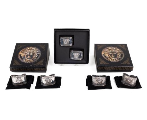 A set of six Gianni Versace silver napkin rings Cased in pairs, with each in its individual dust bag. 6cm wide x 6cm deep x 4