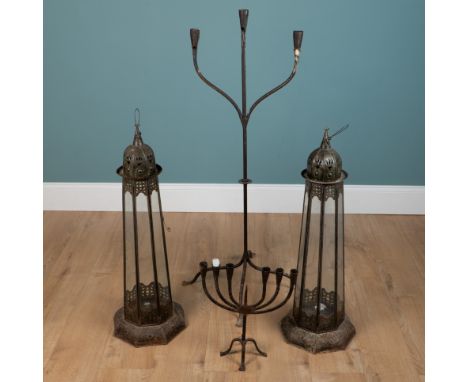 A collection of candlesticks and holders To include a pair of Middle Eastern style tall octagonal lanterns with glass slips, 