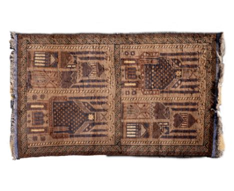 An early 20th century Baluch prayer mat With a divided ground and geometric decorations.143cm x 82cmQty: 1Notable moth damage