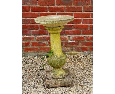 A sundial The cast reconstituted stone sundial with circular dial plate on a base with baluster support and square plinth37.5