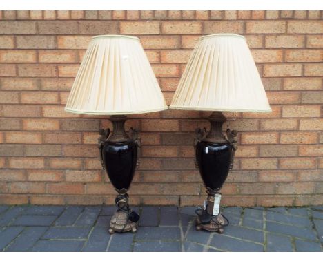 A pair of good quality brass and ceramic table lamps with champagne coloured pleated lamp shades, overall height approximatel