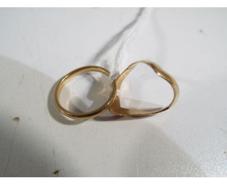 A 9ct gold 2.0mm wide court wedding band, size N and a hallmarked 9 ct yellow gold double wishbone ring, approx size L, appro