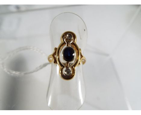 A 18ct triple stone Sapphire and Diamond Georgian style ring, comprising of Central bezel set Sapphire 4x3mm, with an eight c