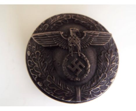A circular screw-top snuff box, the cover decorated with eagle above swastika within wreath, the base scribed in German langu