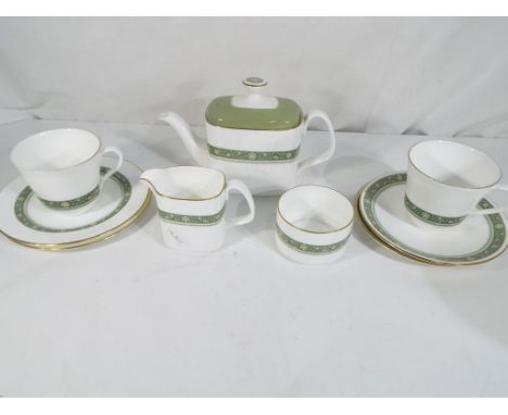 Royal Doulton - a Royal Doulton tea set for two in the Rondelay pattern H5004 comprising a teapot, milk jug, sugar bowl, two 