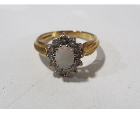 A lady's hallmarked 9 carat gold opal and cz cluster ring, approximate weight 3.4 grams, size O and a half, boxed - Est £40 -