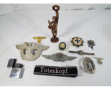 World War Two (WW2) - a cigarette lighter with Waffen SS markings and various cap badges and similar  NOTE: Please read 'Impo